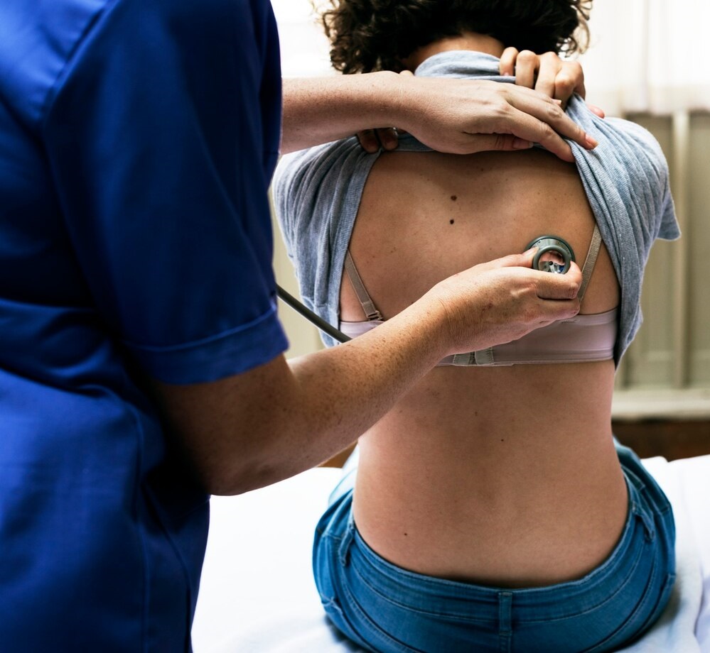 doctor-checking-breathing-patient_53876-146008